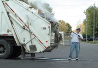 Garbage truck being pressure washed