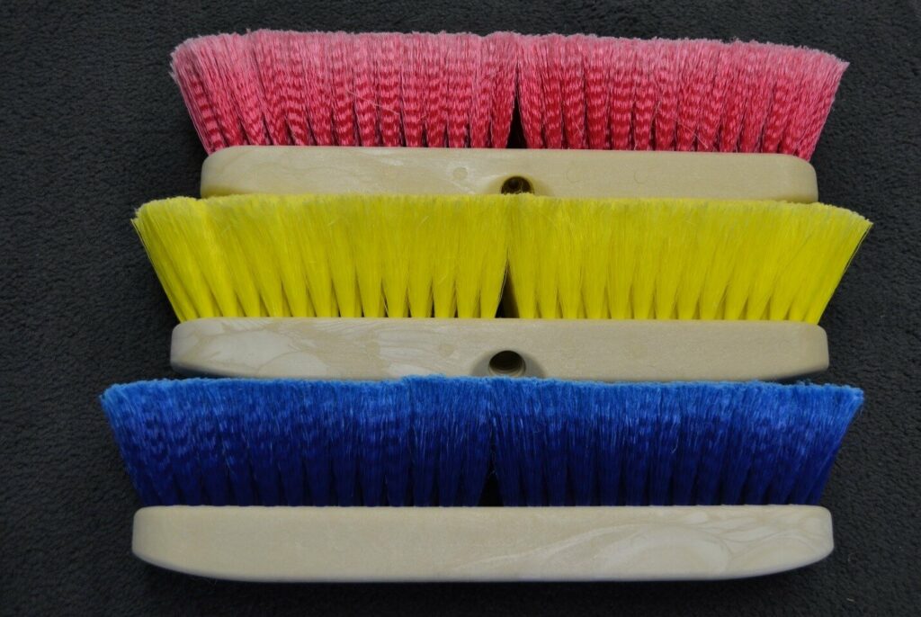 An array of pressure washer brushes.