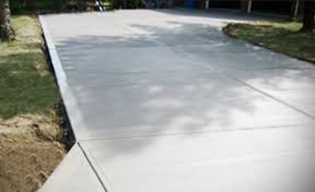 washing concrete with a pressure washer