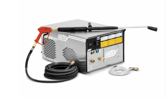 Hotsy electric pressure washer with hose, wand, and accessories for industrial cleaning