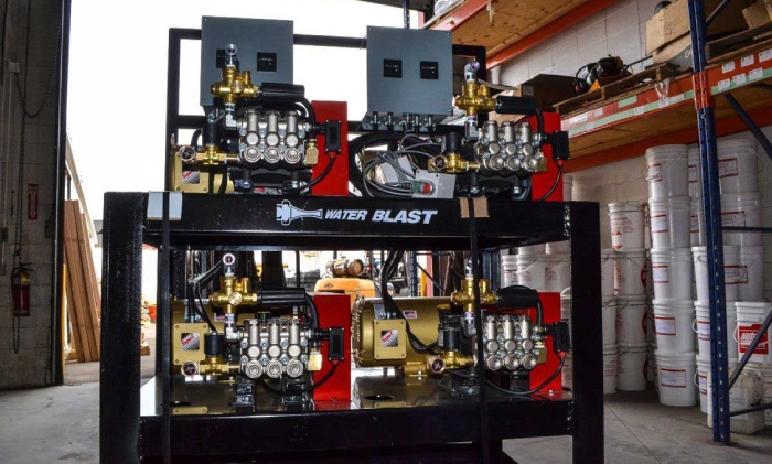 Industrial wash bay system with multiple pressure washer units for commercial cleaning operations