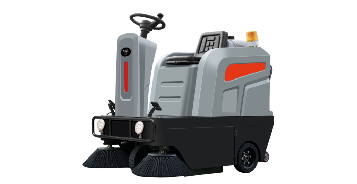 Ride-on commercial floor sweeper machine with dual side brushes designed for warehouse, industrial, and facility floor maintenance.